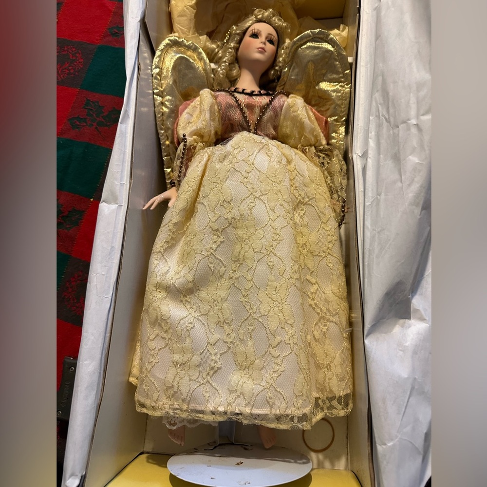 Seymour Mann 18" gold and peach porcelain angel doll - one fixed finger.  1995